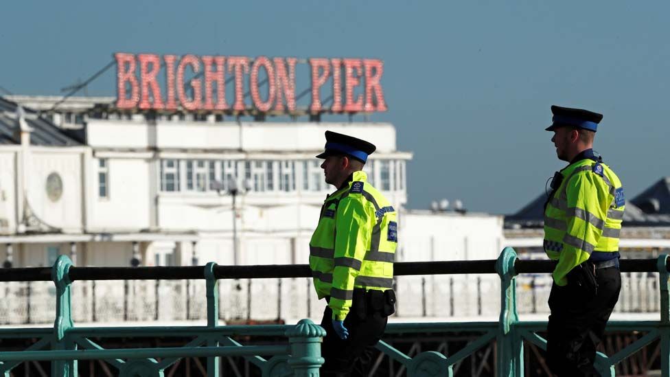 Police on patrol by Brighton pier