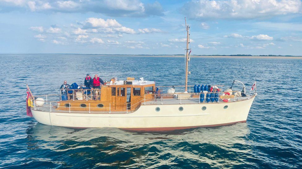 The boat Mimosa with her crew onboard