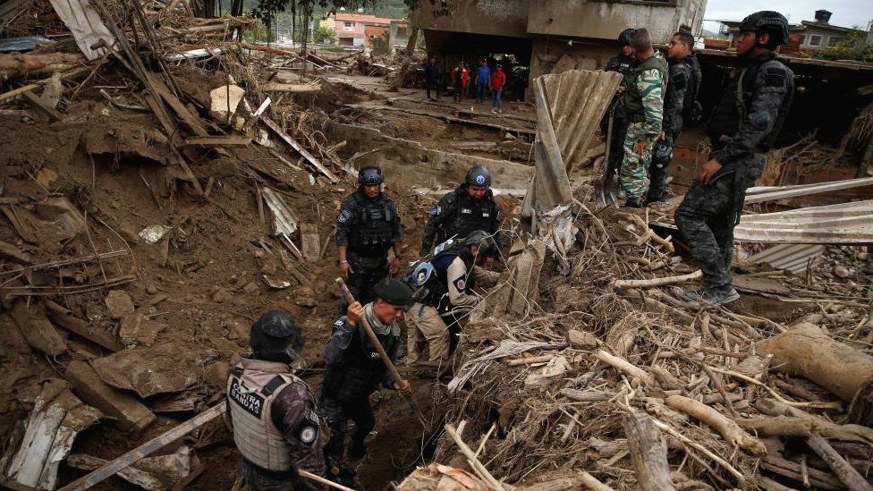 Rescue personnel works in Las Tejerias, Aragua state, which was hit by devastating floods following heavy rain, Venezuela, October 11