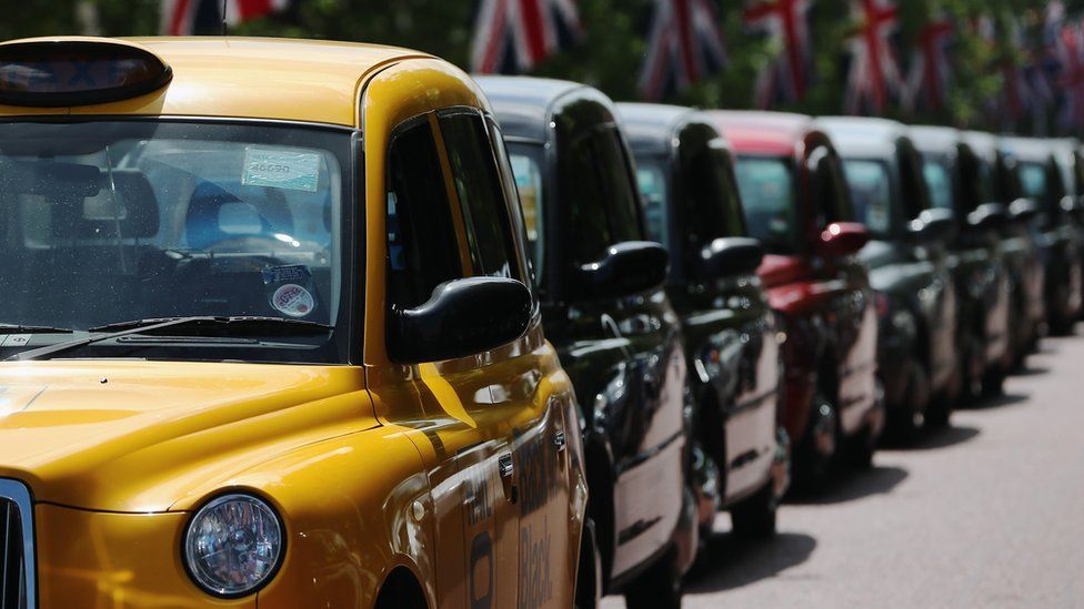 Line of black taxis