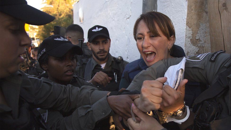 Al Jazeera journalist Givara Budeiri is being taken into custody by Israeli police while she was covering a sitting protest against Israel's decision to evict Palestinian families in Sheikh Jarrah neighbourhood in Jerusalem on 5 June 2021