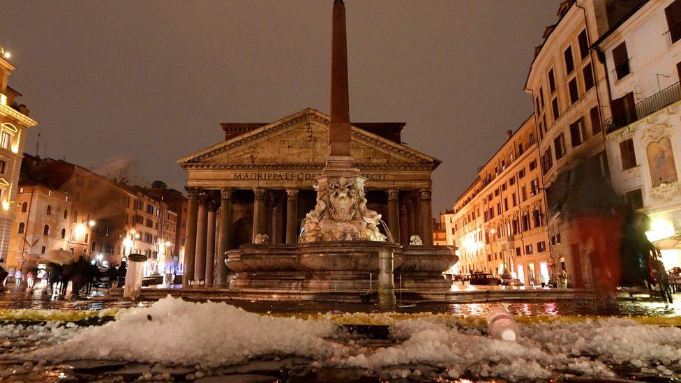 Hail covers the Piazza della Rotonda in front of the Pantheon in central Rome