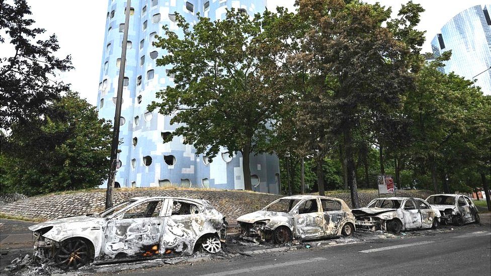 Burnt cars line the street at the foot of the Pablo Picasso estate in Nanterre, west of Paris, following riots after a 17-year-old boy was shot in the chest by police at point-blank range in Nanterre, France