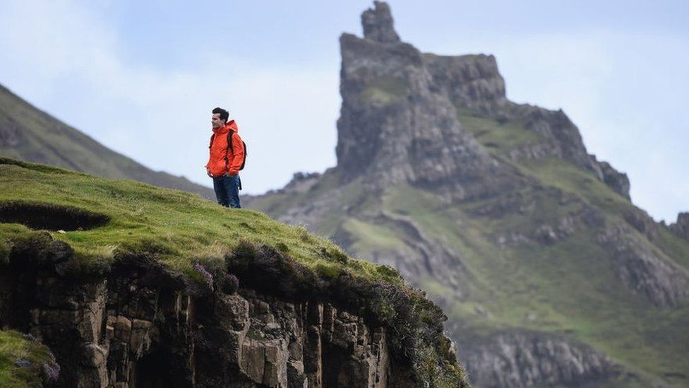 A tourist visiting the Quiraing in 2017