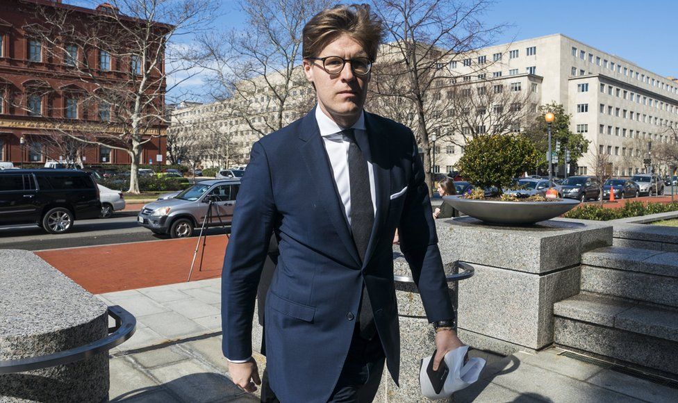 Alex Van Der Zwaan walks into the Washington field office of the FBI