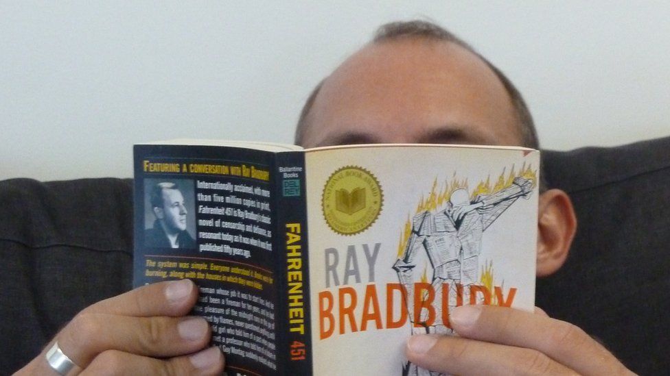 Man reading Ray Bradbury book