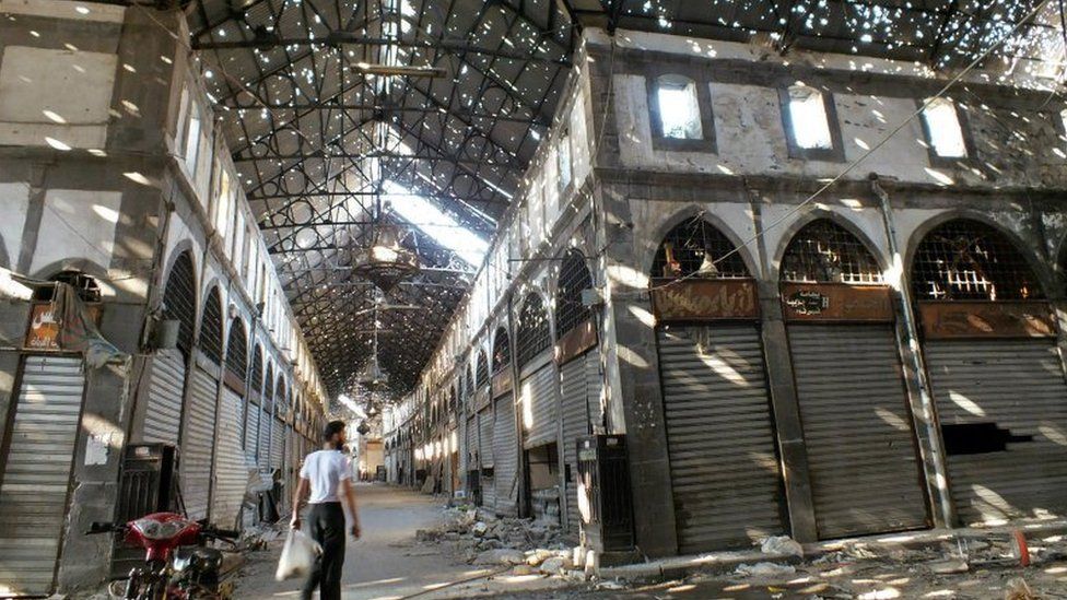 A man walks through the souk in the Old City of Homs (20 August 2013)