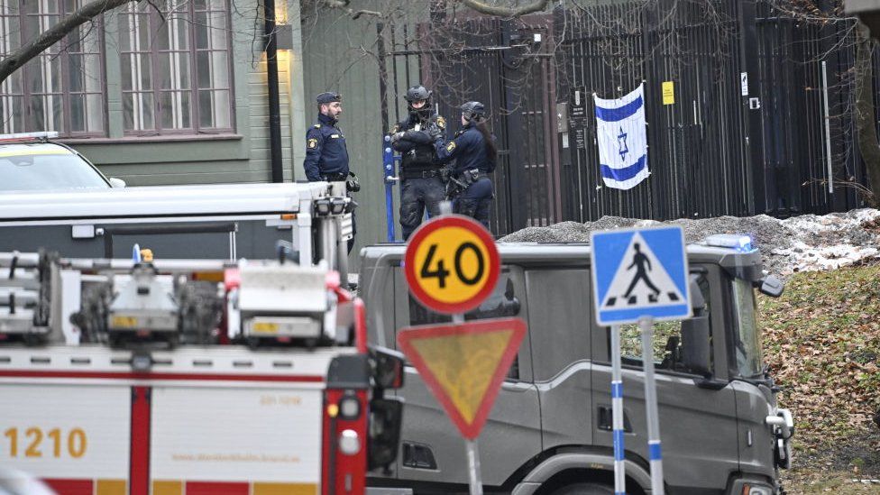 Police officers and vehicles outside the Israeli embassy in Stockholm