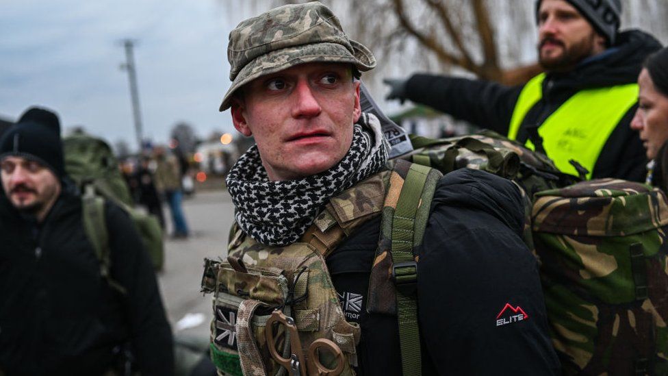 Alex from the United Kingdom who served in Afghanistan as a paramedic arrives at the Polish-Ukrainian border crossing looking for transport to Lviv to join the fight against the Russian invasion - 6 March 2022