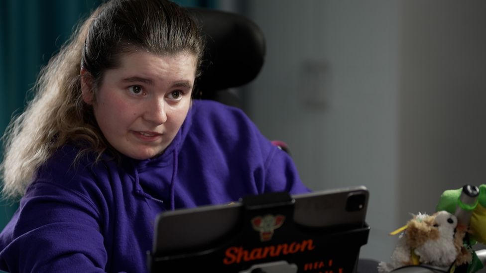 Shannon sitting in front of her computer