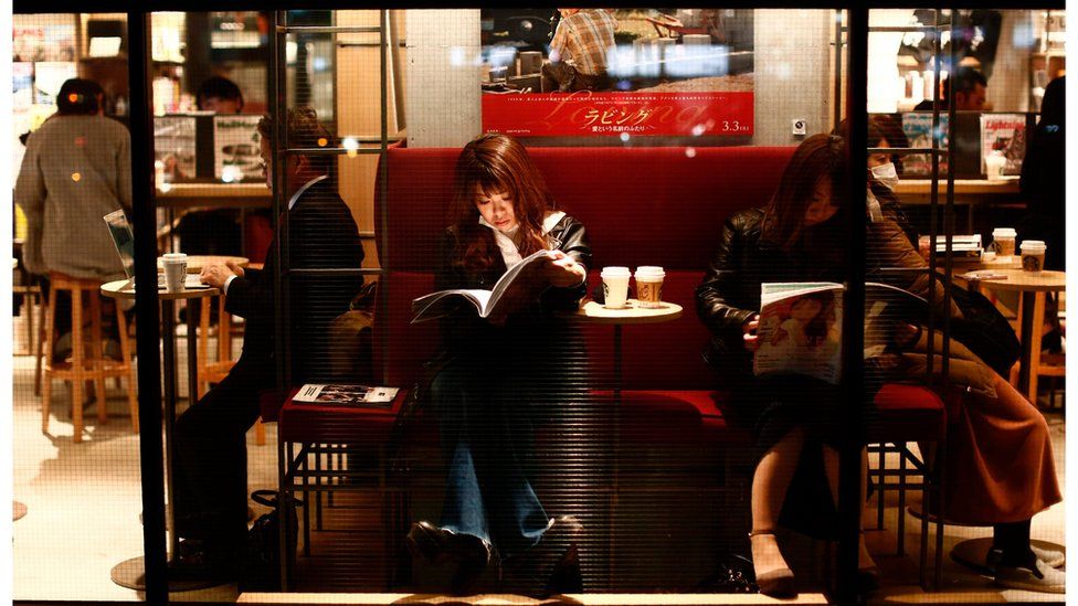 People read at a cafe in Meguro neighbourhood in Tokyo, Japan, on March 8, 2017.