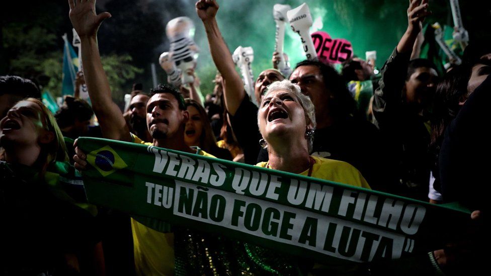 Supporters of Brazilian far-right presidential candidate Jair Bolsonaro celebrate his victory at the Paulista Avenue, in Sao Paulo, Brazil, 28 October 2018.