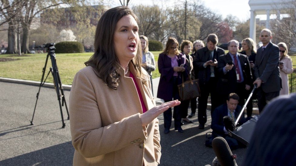White House Press Secretary Sarah Huckabee Sanders speaks to members of the news media following a television interview during which she spoke on Special Counsel Robert Mueller's report on Russian interference in the 2016 election, outside the West Wing of the White House in Washington