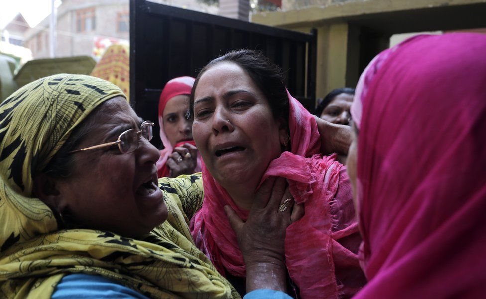 Tasleema crying after she was attacked in her home and her hair was chopped off