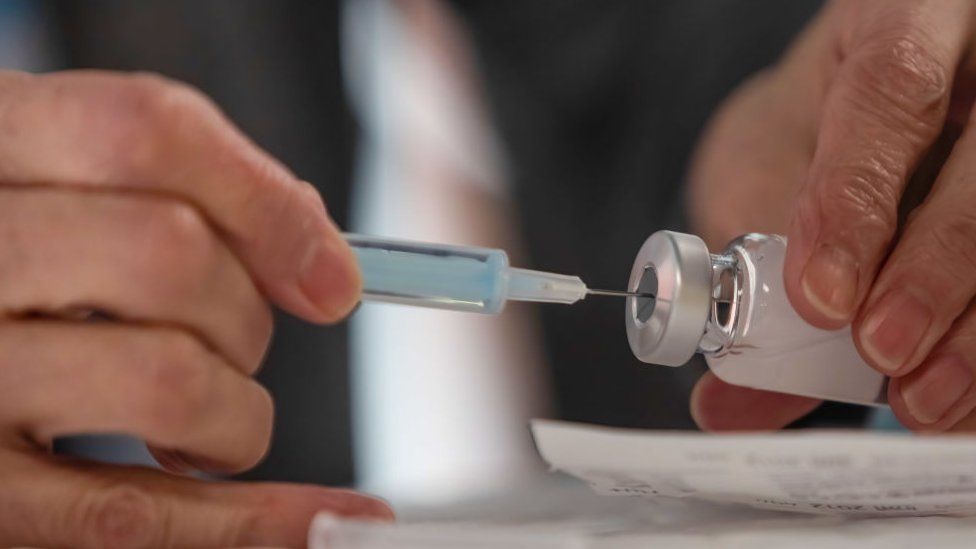 A nurse prepares the AstraZeneca vaccine in Madrid, Spain