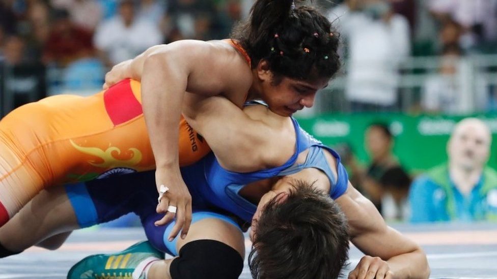 India"s Sakshi Malik (red) wrestles with Kirghyzstan"s Aisuluu Tynybekova in their women"s 58kg freestyle bronze medal match on August 17, 2016, during the wrestling event of the Rio 2016 Olympic Games at the Carioca Arena 2 in Rio de Janeiro. / AFP PHOTO / Jack GUEZJACK GUEZ/AFP/Getty Images