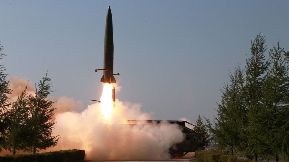 A missile is seen launched during a military drill in North Korea
