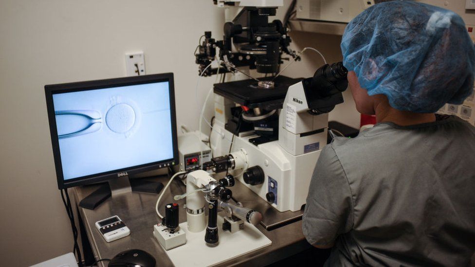 An embryologist is seen at work at the Virginia Center for Reproductive Medicine