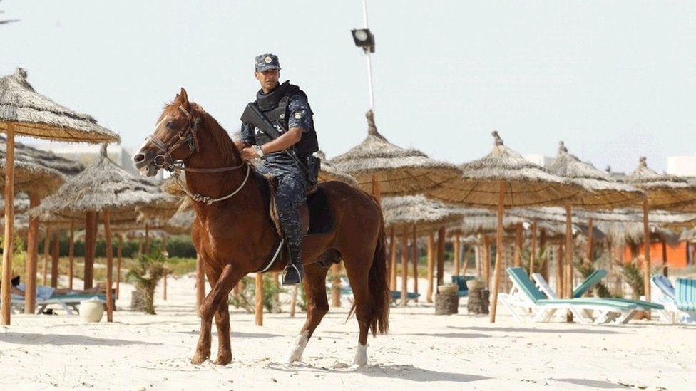 Tourist police officers patrol the beach in Hammamet, Tunisia, Jun18