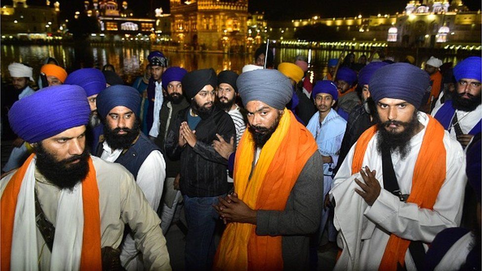 Waris Punjab De Chief Amritpal Singh with his close aide Lovepreet Toofan and other supporters paying obeisance at Golden Temple on February 24, 2023 in Amritsar, India.