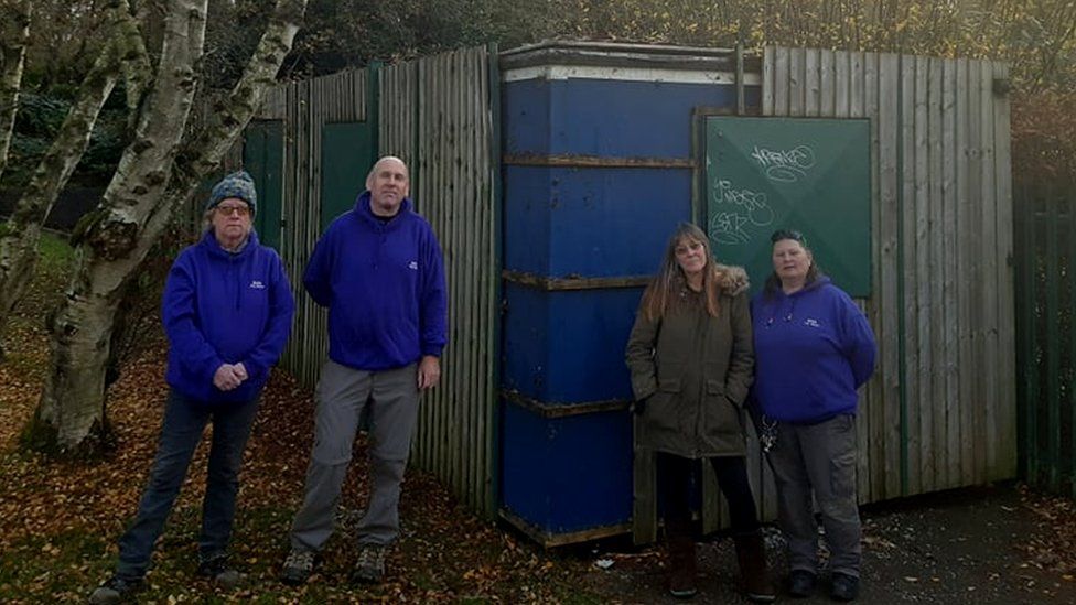 Some of the workers at Meriden Adventure Playground stand outside the storage unit in which toys and clothing was stolen
