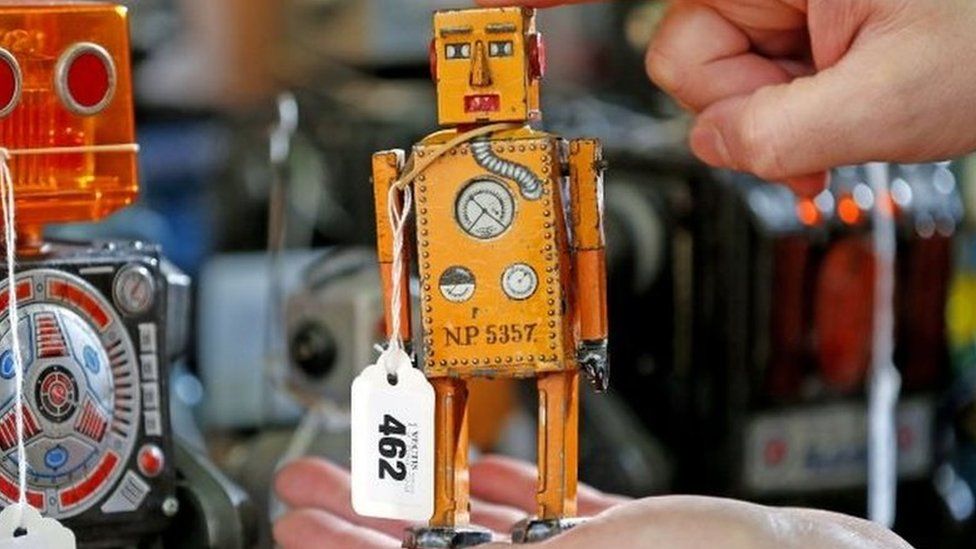 Andy Reed, die cast specialist at Vectis Auctions holds Robot Lilliput from Japan, a wind up robot from 1939