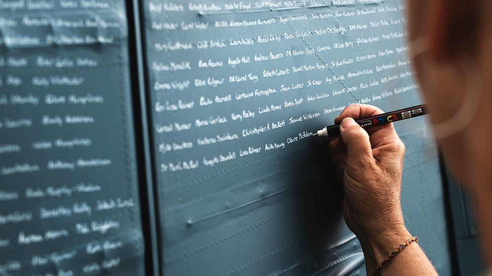 Names being written on spitfire