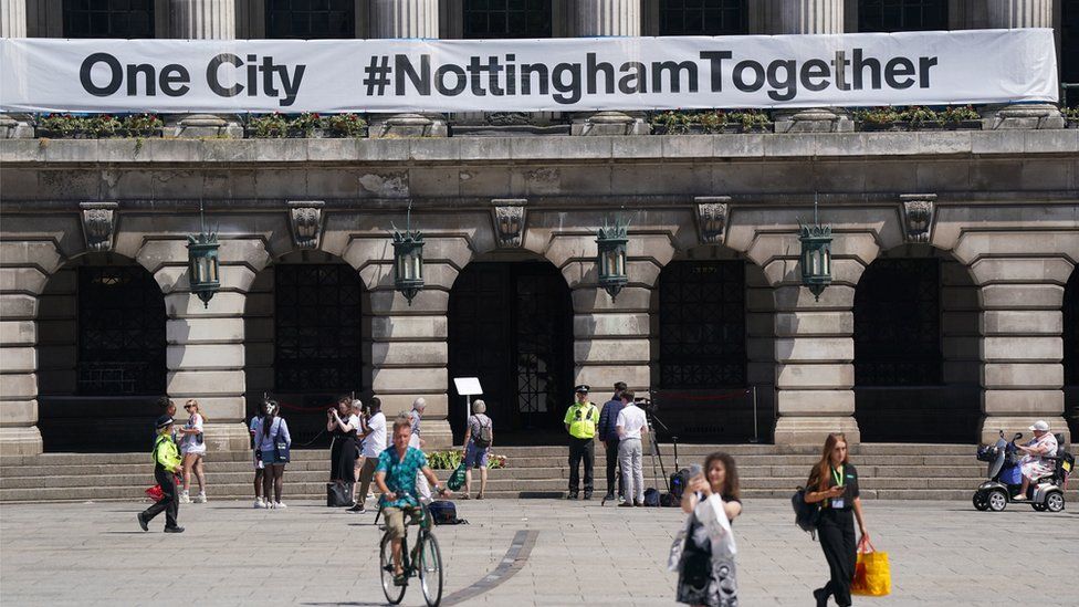 A banner is placed on the outside of City Council buildings in Market Square, Nottingham