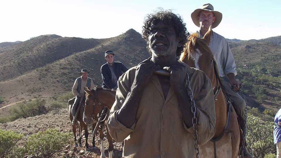 David Gulpilil with other actors in a scene from The Tracker