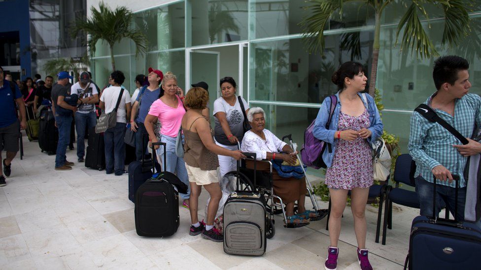 People queue for buses in Puerto Vallarta - 23 October