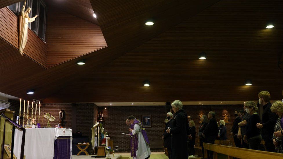 A vigil is held at Saint Peter's Catholic Church, following the stabbing of UK Conservative MP Sir David Amess