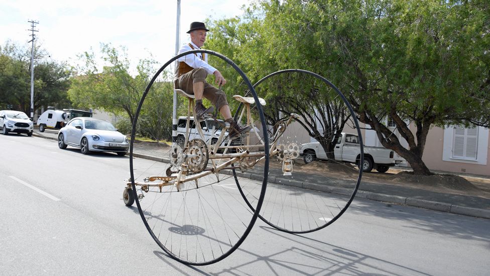 A man rides a tricycle he built during a jazz festival in Prince Albert, South Africa - Saturday 6 May 2023