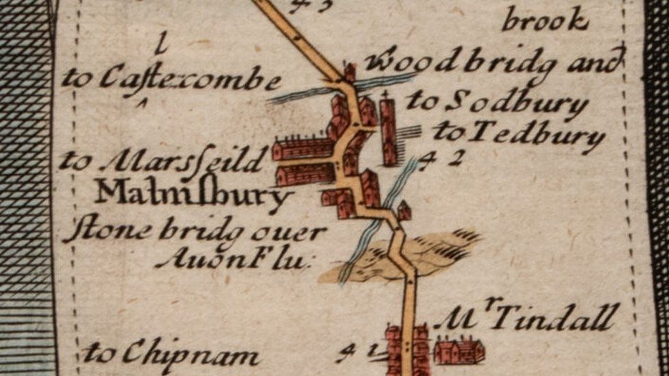 A section of the old map, a thick yellow line showing the road, with buildings alongside it and place names