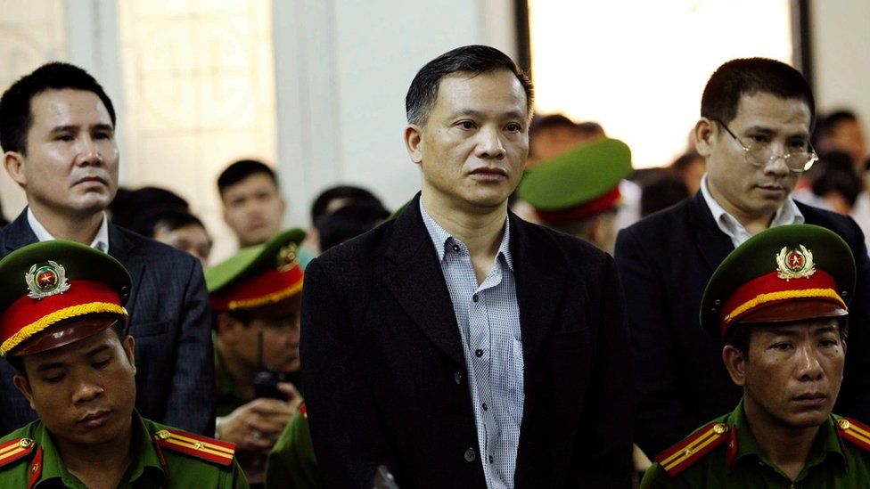 Prominent Vietnamese lawyer Nguyen Van Dai stands during the trial in Hanoi on 5 April 2018