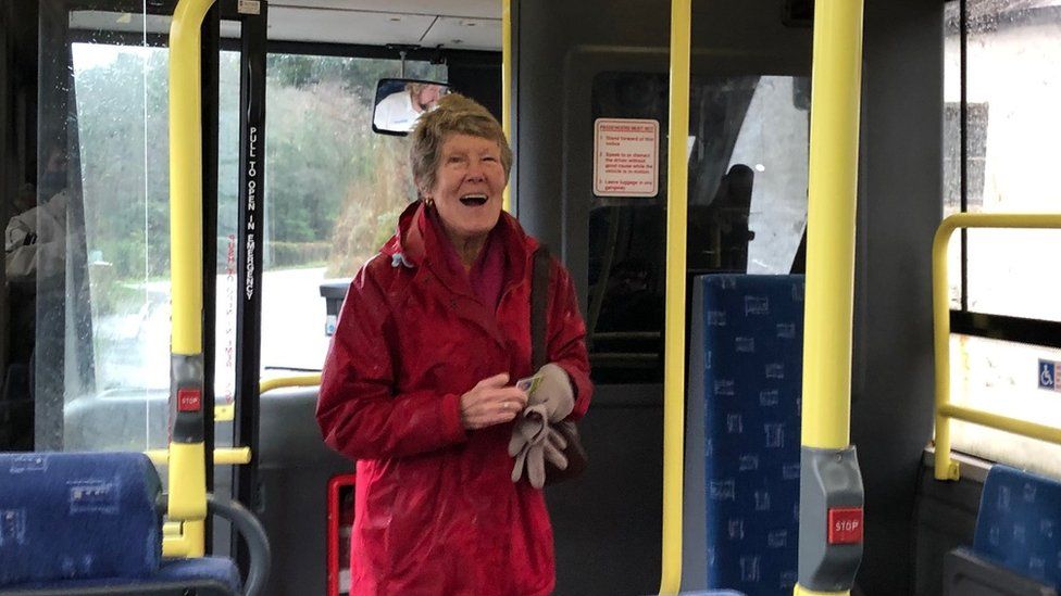 Photo of Julie Jones boarding the bus