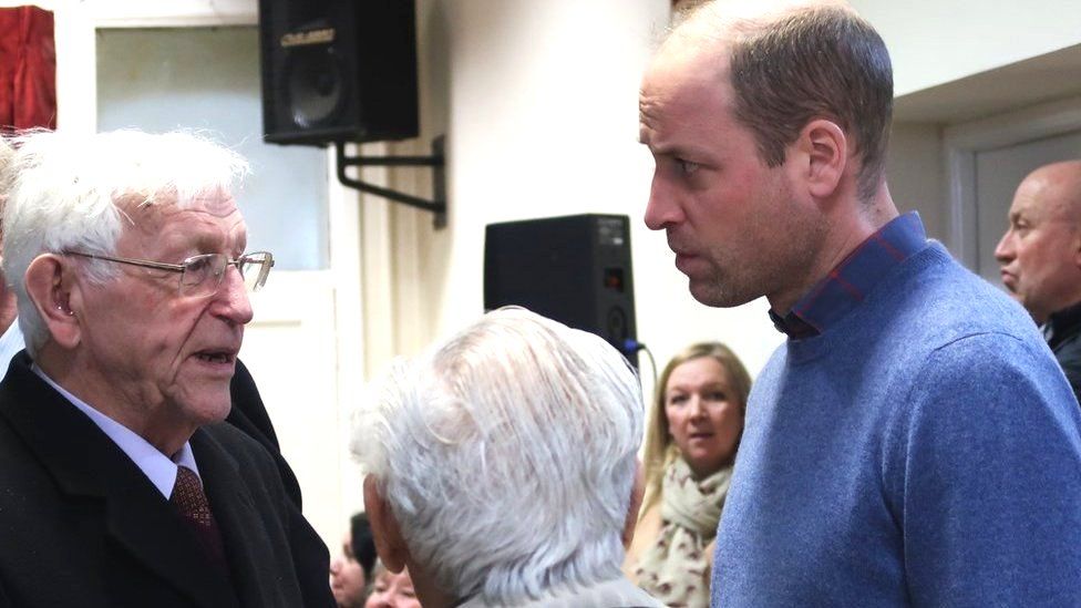 Prince William talking to members of the public