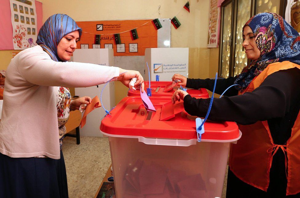 A Libyan woman casts her ballot at a polling station during legislative elections in the capital Tripoli on June 25, 2014. Polling was under way across Libya in a general election seen as crucial for the future of a country hit by months of political chaos and growing unrest.
