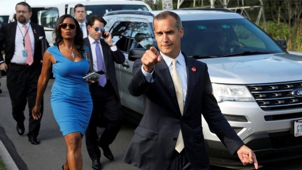 Corey Lewandowski (C) says hello to reporters as he and White House advisors Sebastian Gorka (from L), Omarosa Manigault, White House Staff Secretary Rob Porter and Communications Director Anthony Scaramucci attend an event in Ohio in 2017