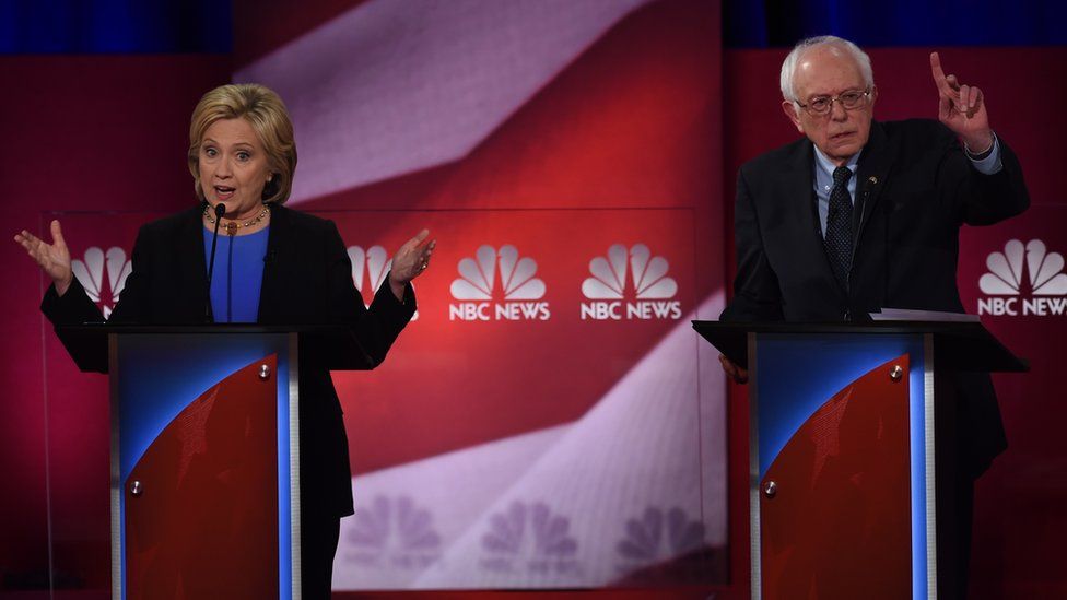 Democratic presidential candidates, former Secretary of State Hillary Clinton (L) and Vermont Senator Bernie Sanders (R) participate in the NBC News -YouTube Democratic Candidates Debate on January 17, 2016