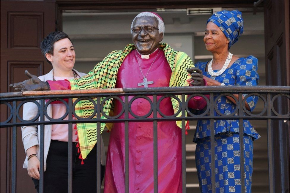 Desmond and Leah Tutu Legacy Foundation CEO Janet Jobson, and Archbishop Desmond Tutu Intellectual Property Trust chairperson Mamphela Ramphele unveil an installation of a statue of Archbishop Desmond Tutu. The statue is wearing a special Palestinian-African, scarf symbolising the Archbishop's decades-long work for justice in Palestine.