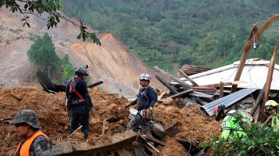 Rescue workers at the scene of a landslide in Guatemala