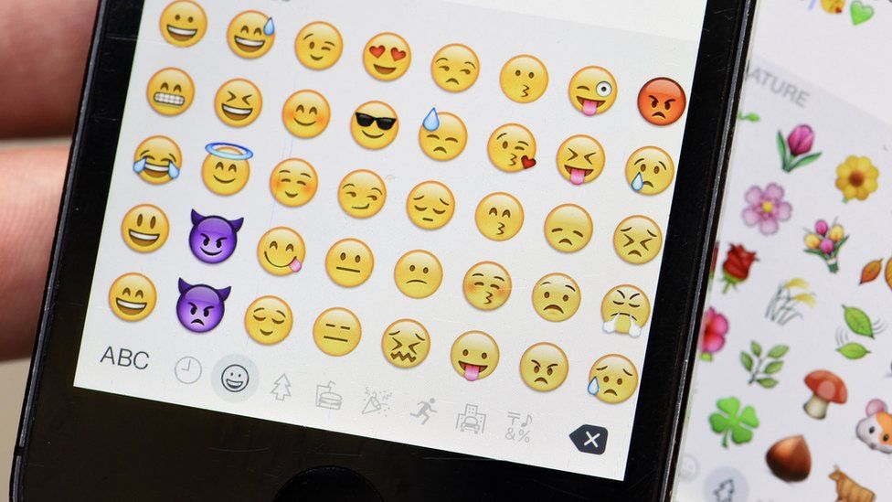 A smartphone emoji keyboard