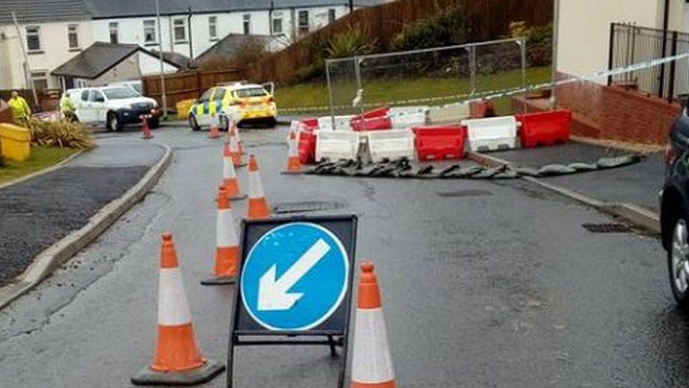 Motorists have to drive on the pavement to get in and out of the estate