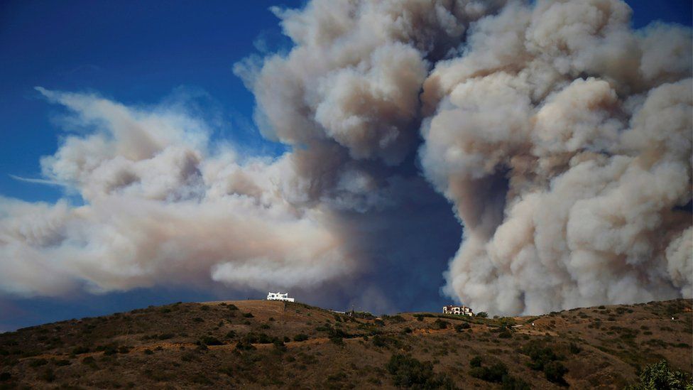 Smoke from a wildfire is seen in Calabasas, California