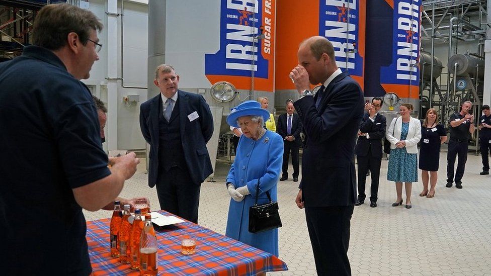 Prince William sips Irn Bru in front of the AG Barr factory, next to the Queen