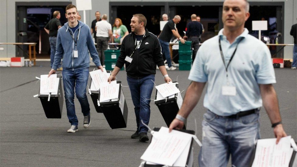 Ballot boxes are brought in to the counting at the Glasgow count centre at the Emirates Arena