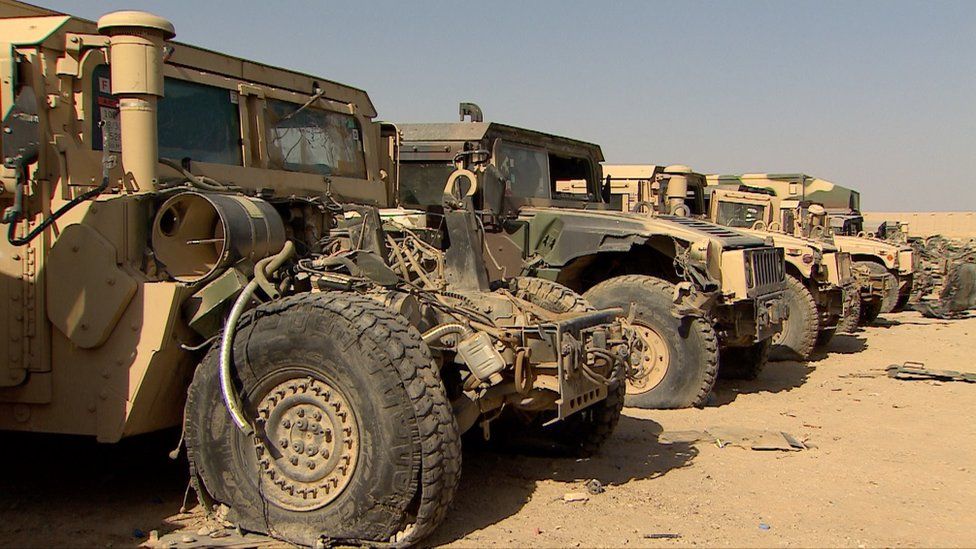 Wrecked Afghan Army vehicles at a disposal sight in Helmand, July 2016