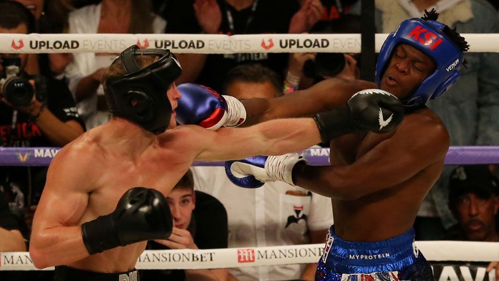 Logan Paul and KSI during their boxing match at Manchester Arena