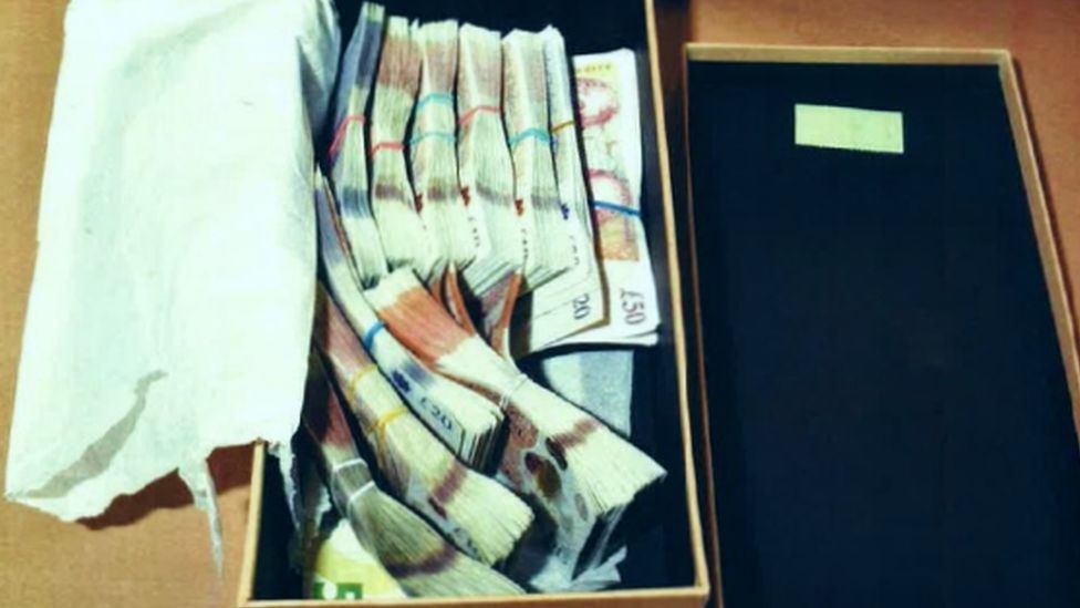 Shoebox of cash