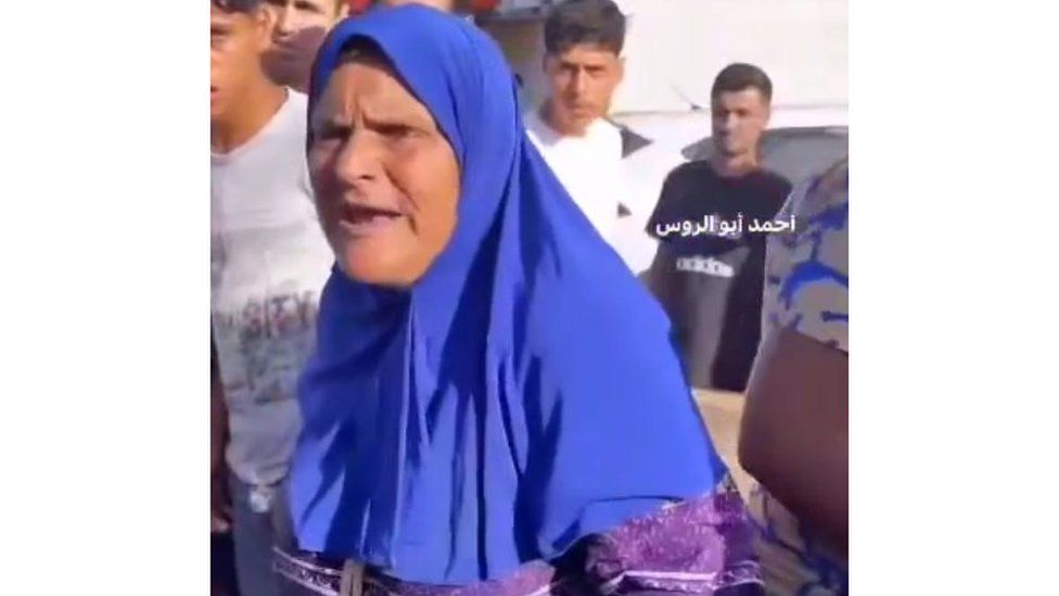 A still of a video posted on Telegram with a woman saying she found her sons body on Salah al-Din Road